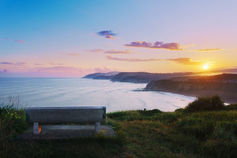 bench with view of Sopelana coast at the sunrise