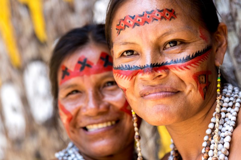 Native Brazilian women portrait at an indigenous tribe in the Amazon