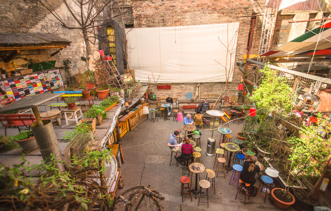 Outdoor terrace of one of the most attractive and touristic ruin pubs in Budapest, the Szimpla Kert.