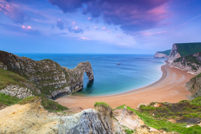 Jurassic Coast of Dorset with Durdle Door at sunrise , UK