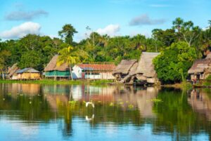 View of a small village in the Amazon rain forest on the shore of the Yanayacu River in Peru