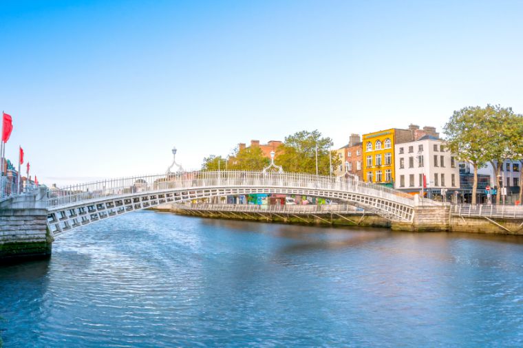 View of Hapenny Bridge over Liffey river in Dublin, Ireland