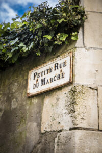 Old French street sign Petite Rue Du Marche
