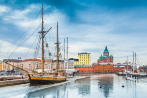 Beautiful view of the old town of Helsinki with famous Uspenski eastern orthodox cathedral church and old port in Katajanokka district of Helsinki on a cold day in winter, Finland.